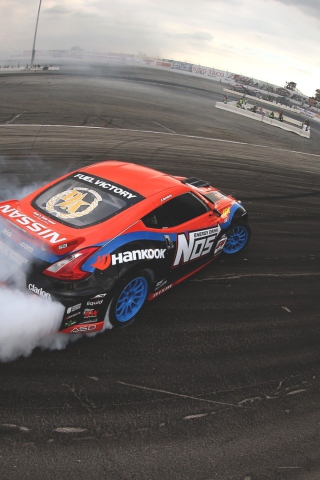 Fondo de pantalla Nissan Gto Drift On Race Track 320x480