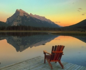 Screenshot №1 pro téma Wooden Chair With Pieceful Lake View 176x144
