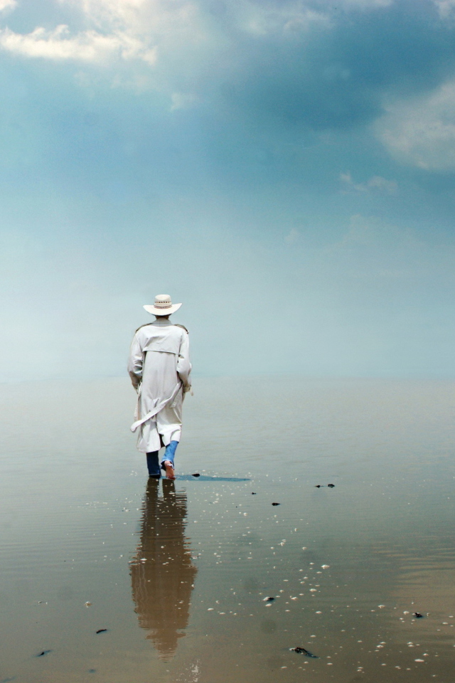 Man In White Hat Walking On Water wallpaper 640x960