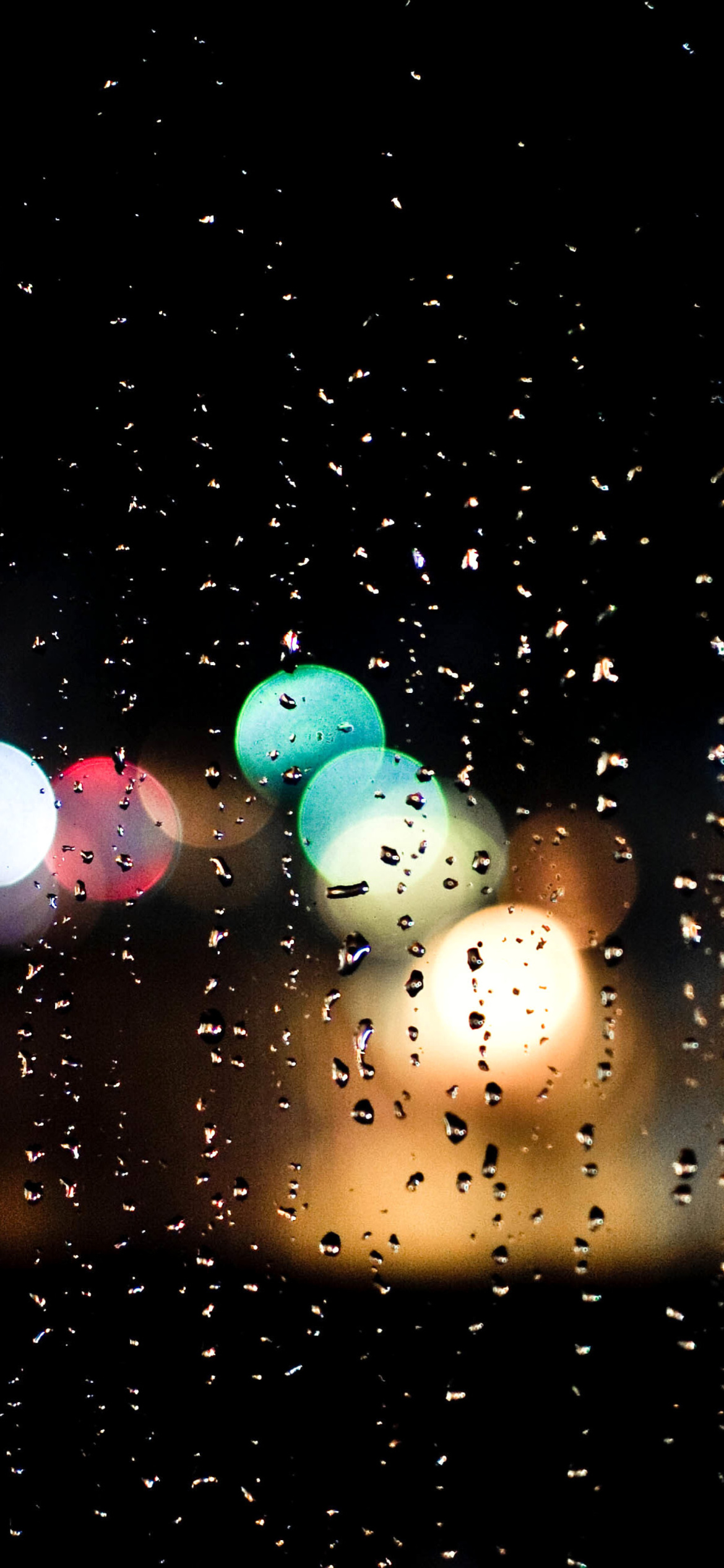 Raindrops on Window Bokeh Photo wallpaper 1170x2532