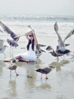 Sfondi Girl And Birds At Sea Coast 240x320
