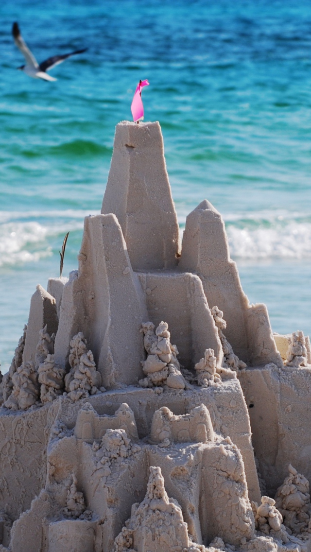 Sandcastles On Beach wallpaper 640x1136