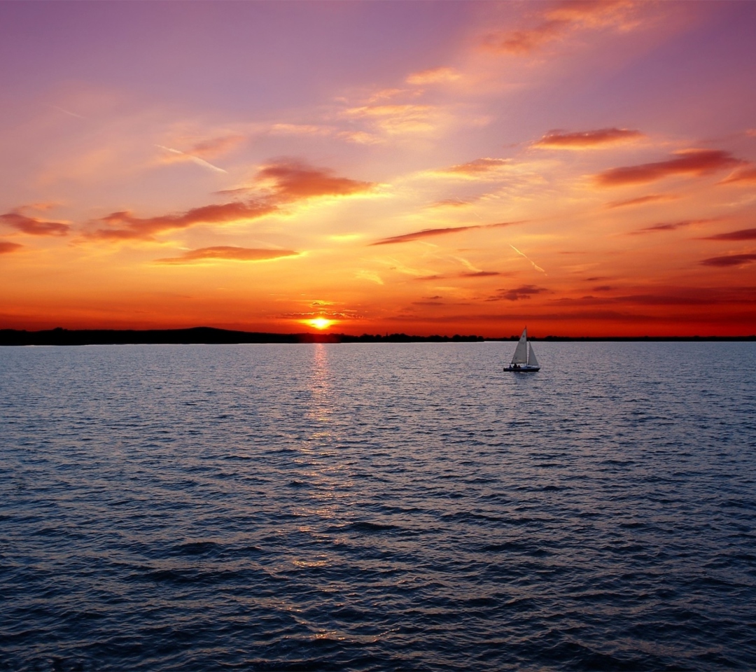 Fondo de pantalla Ship In Sea At Sunset 1080x960