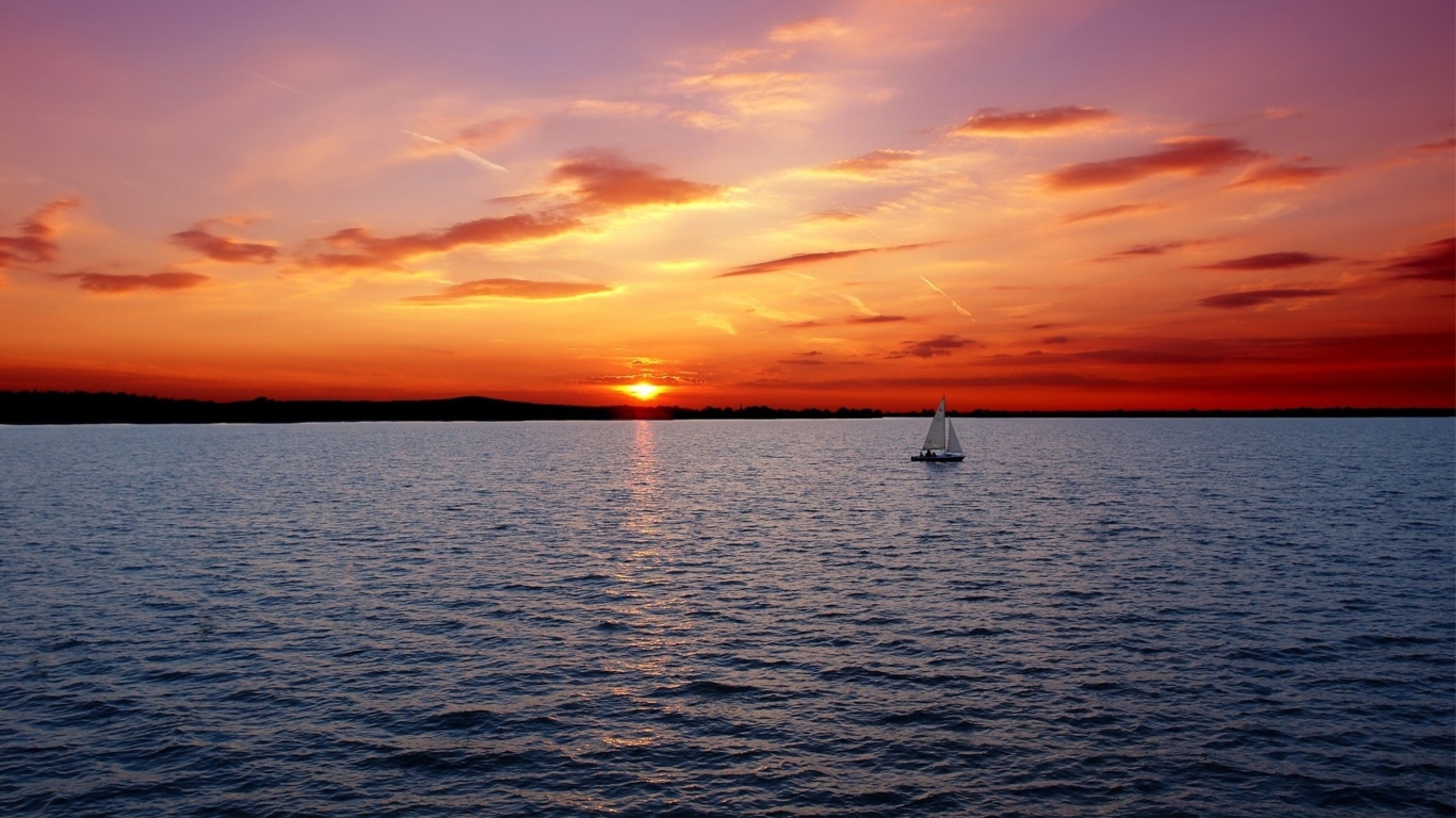Ship In Sea At Sunset wallpaper 1366x768