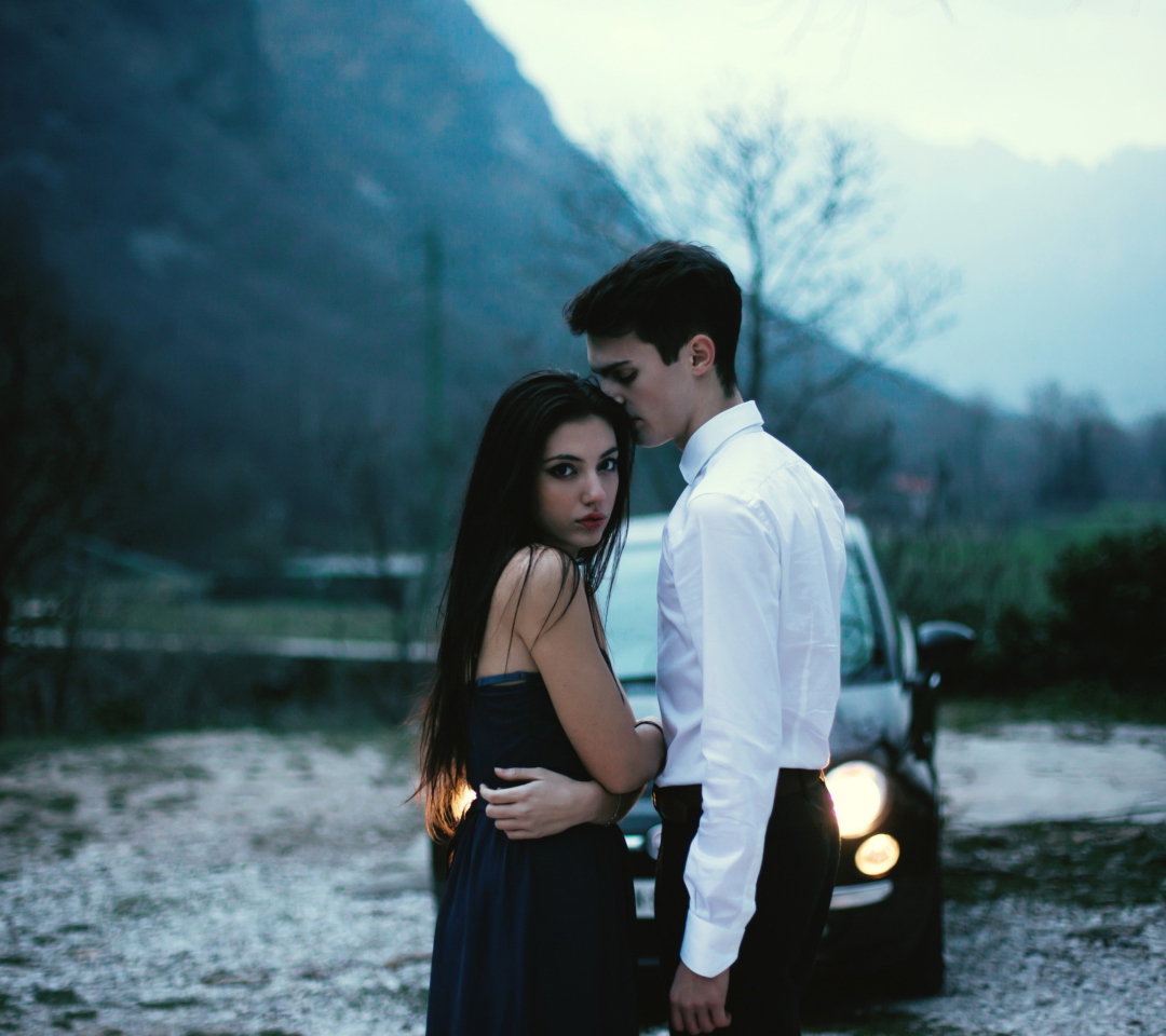 Das Couple In Front Of Car Wallpaper 1080x960