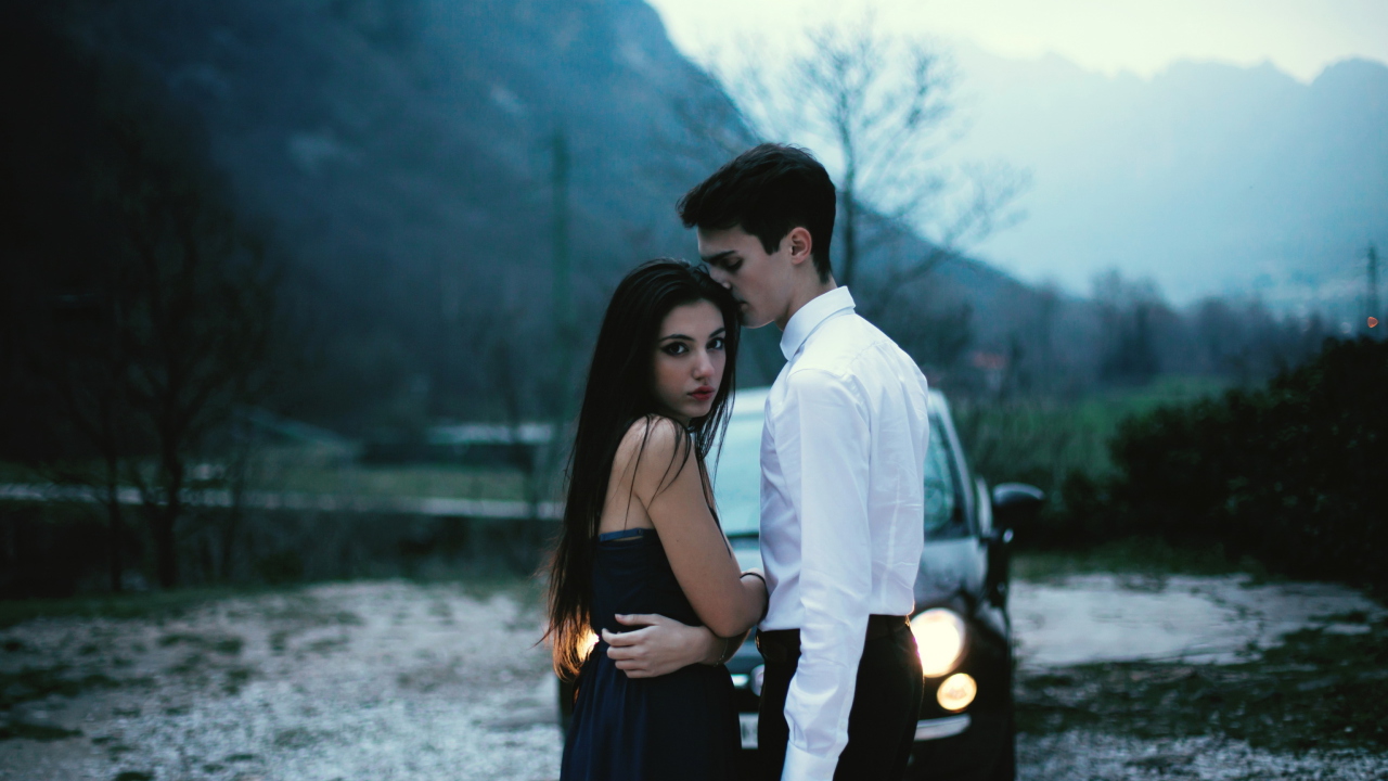 Couple In Front Of Car wallpaper 1280x720