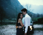 Couple In Front Of Car wallpaper 176x144