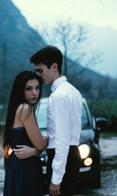 Das Couple In Front Of Car Wallpaper 480x800
