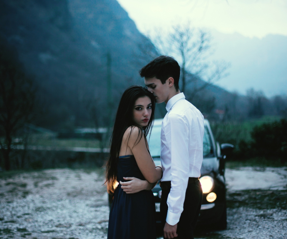 Das Couple In Front Of Car Wallpaper 960x800