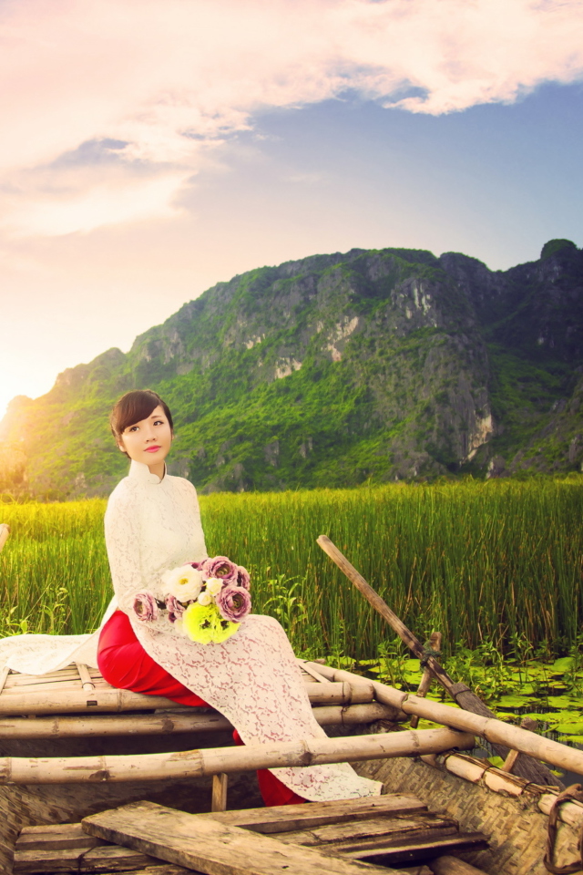 Sfondi Beautiful Asian Girl With Flowers Bouquet Sitting In Boat 640x960