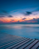 Orange Sunset Over Blue Sea screenshot #1 128x160