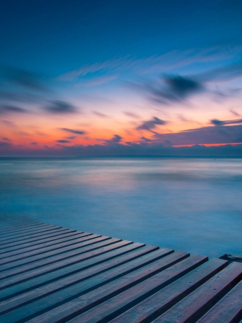 Orange Sunset Over Blue Sea screenshot #1 480x640