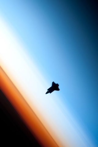 Shuttle In Outer Space wallpaper 320x480