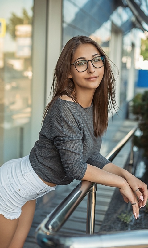 Pretty girl in glasses wallpaper 480x800