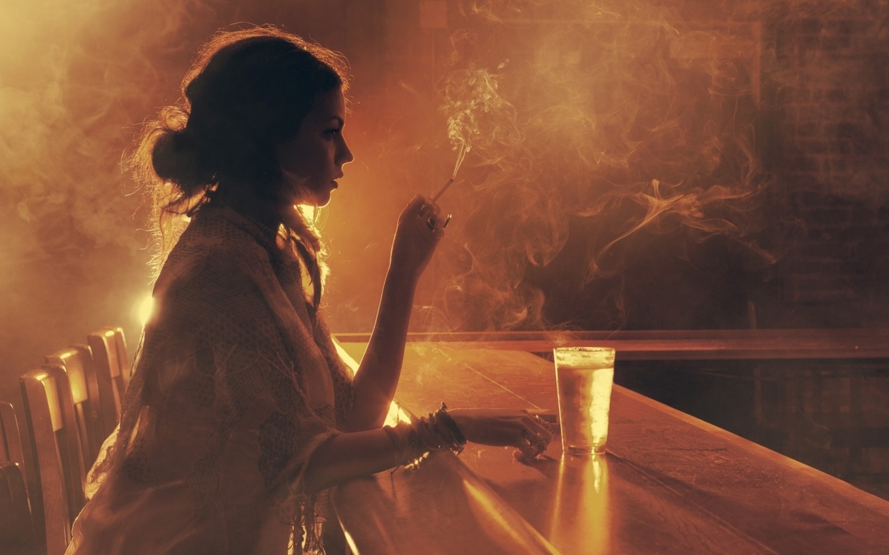 Sad girl with cigarette in bar wallpaper 1280x800