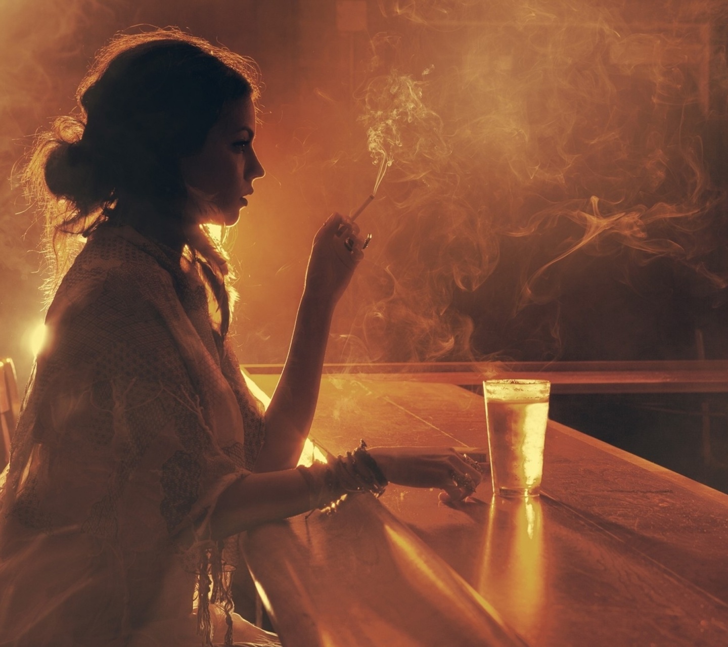Sad girl with cigarette in bar wallpaper 1440x1280