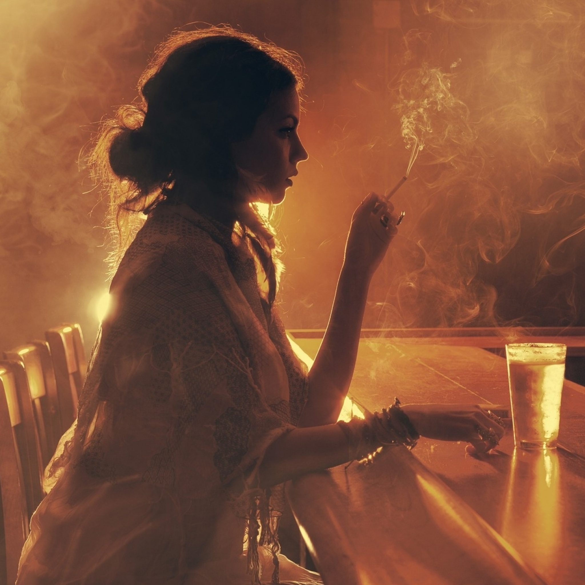 Sad girl with cigarette in bar wallpaper 2048x2048