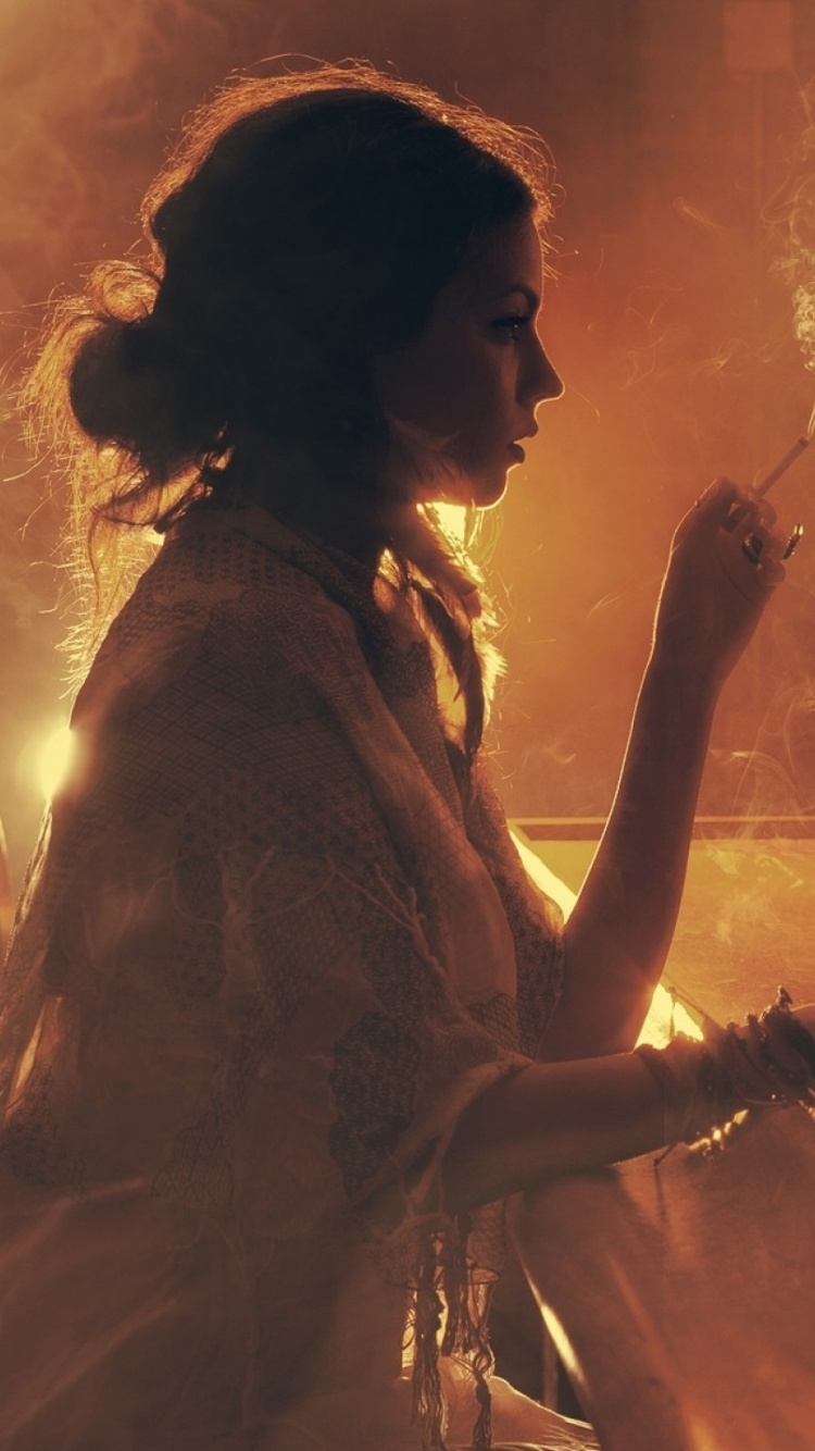 Sad girl with cigarette in bar wallpaper 750x1334