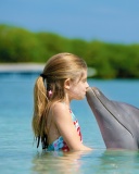 Das Girl and dolphin kiss Wallpaper 128x160
