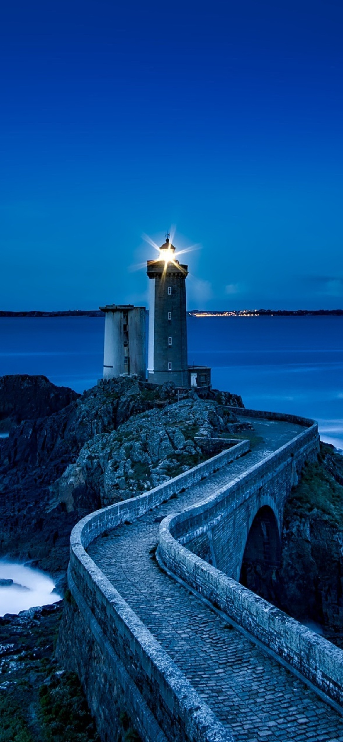 France Lighthouse in Ocean wallpaper 1170x2532