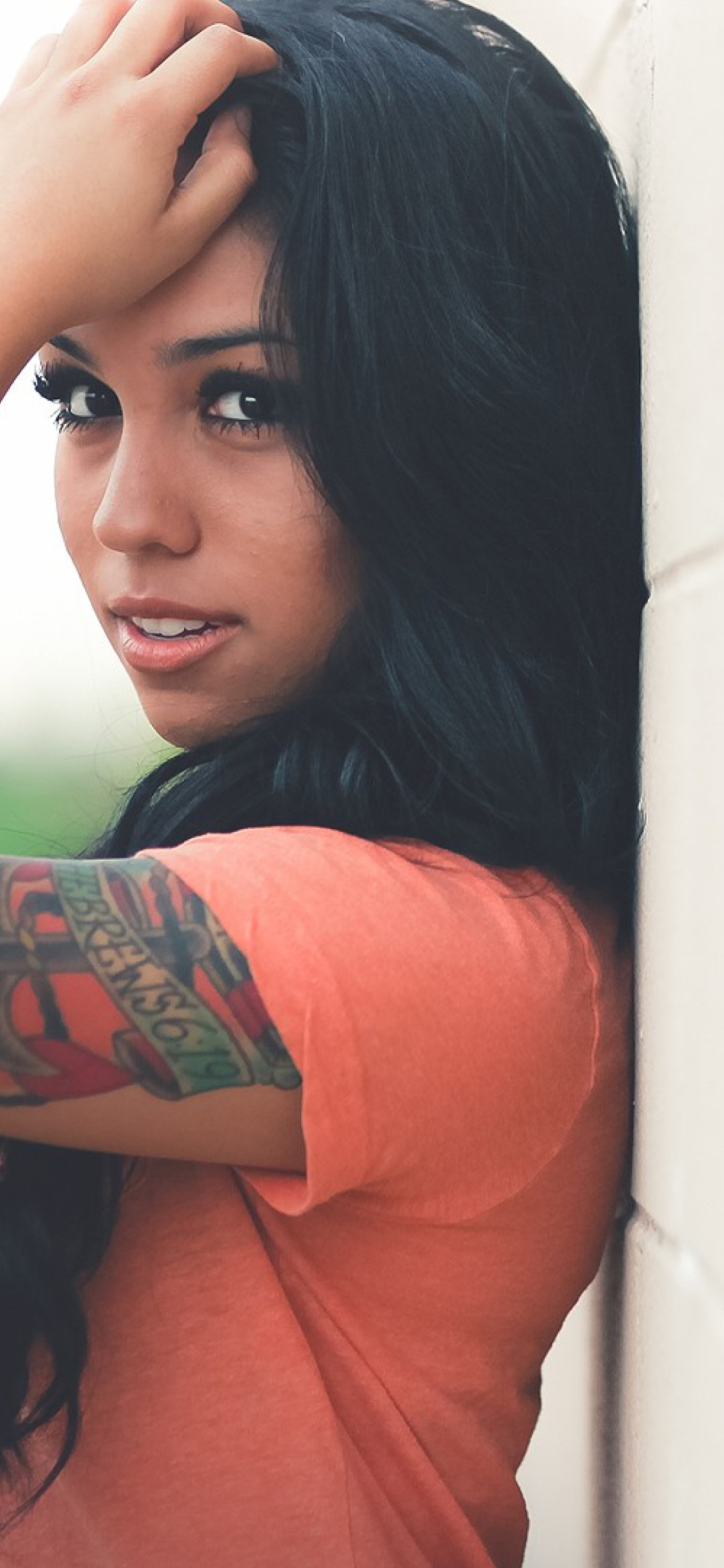 Beautiful Latin American Model With Tattoos wallpaper 1170x2532