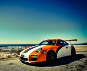 Orange Porsche 997 wallpaper 176x144