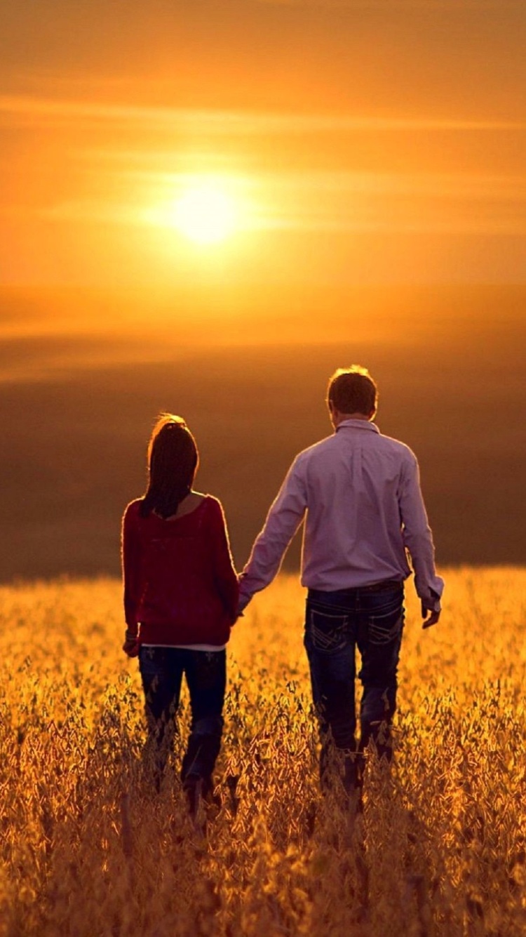 Couple at sunset wallpaper 750x1334