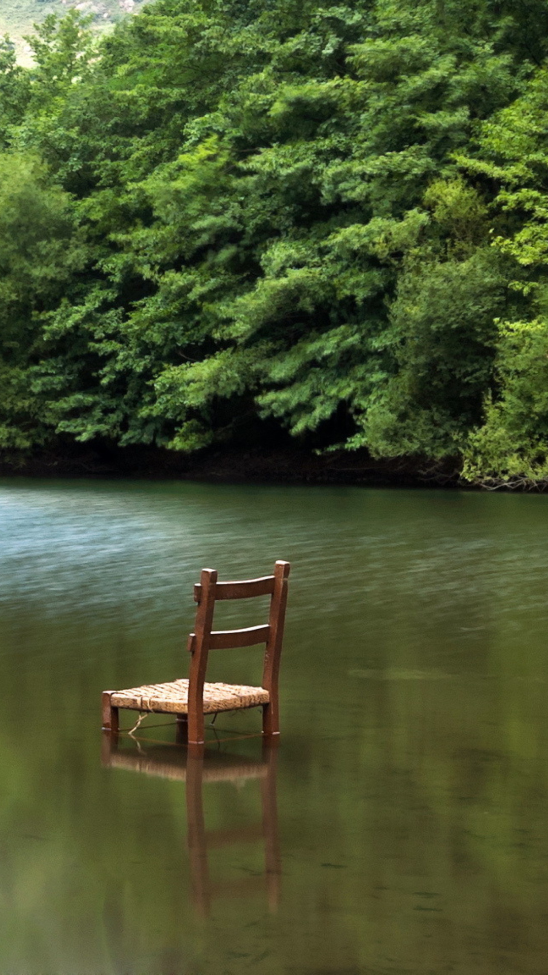 Sfondi Chair In Middle Of Pieceful Lake 1080x1920