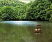 Das Chair In Middle Of Pieceful Lake Wallpaper 176x144
