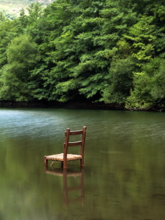 Chair In Middle Of Pieceful Lake wallpaper 240x320