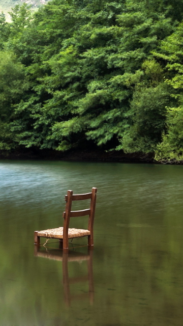 Das Chair In Middle Of Pieceful Lake Wallpaper 360x640