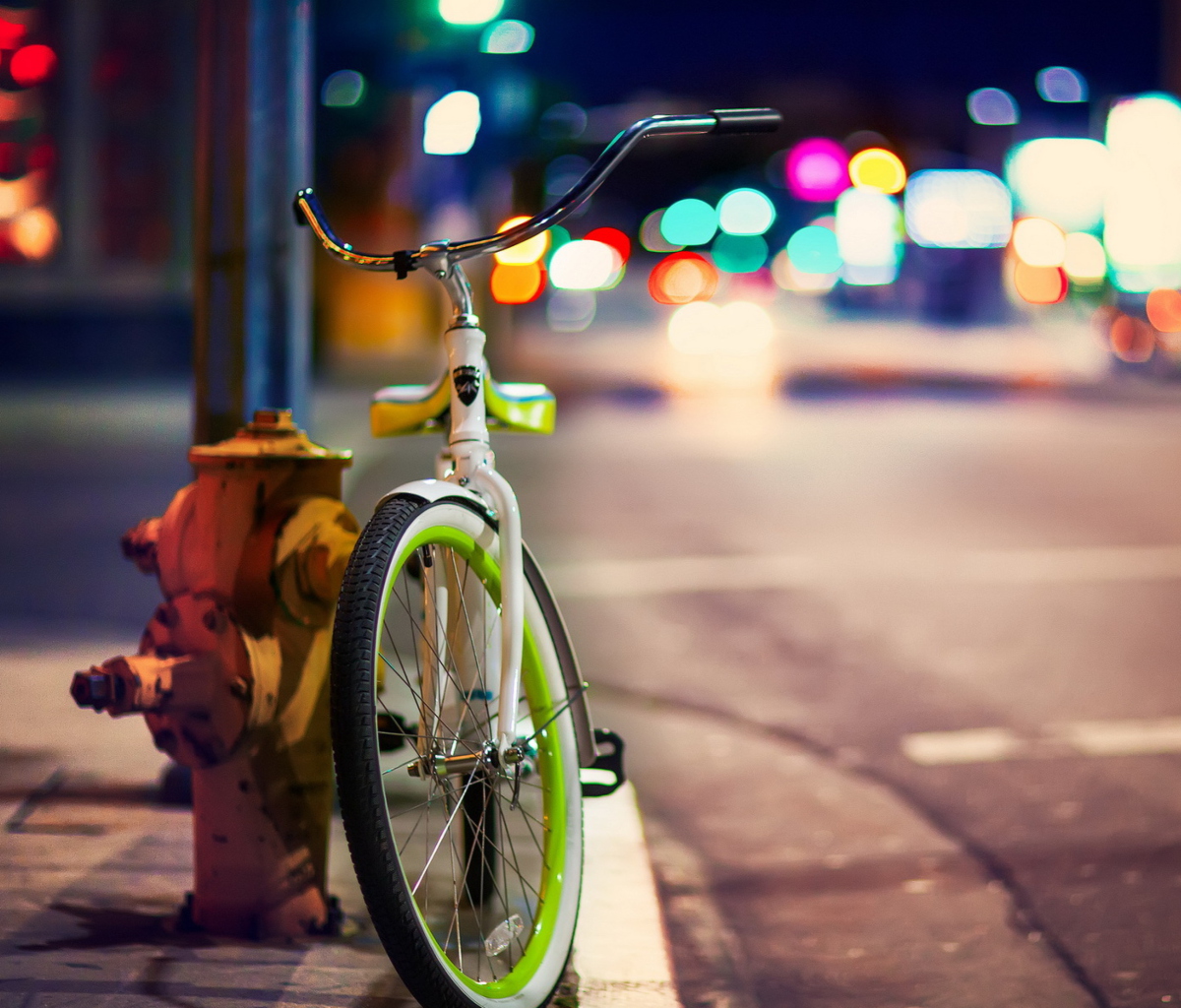 Green Bicycle In City Lights wallpaper 1200x1024