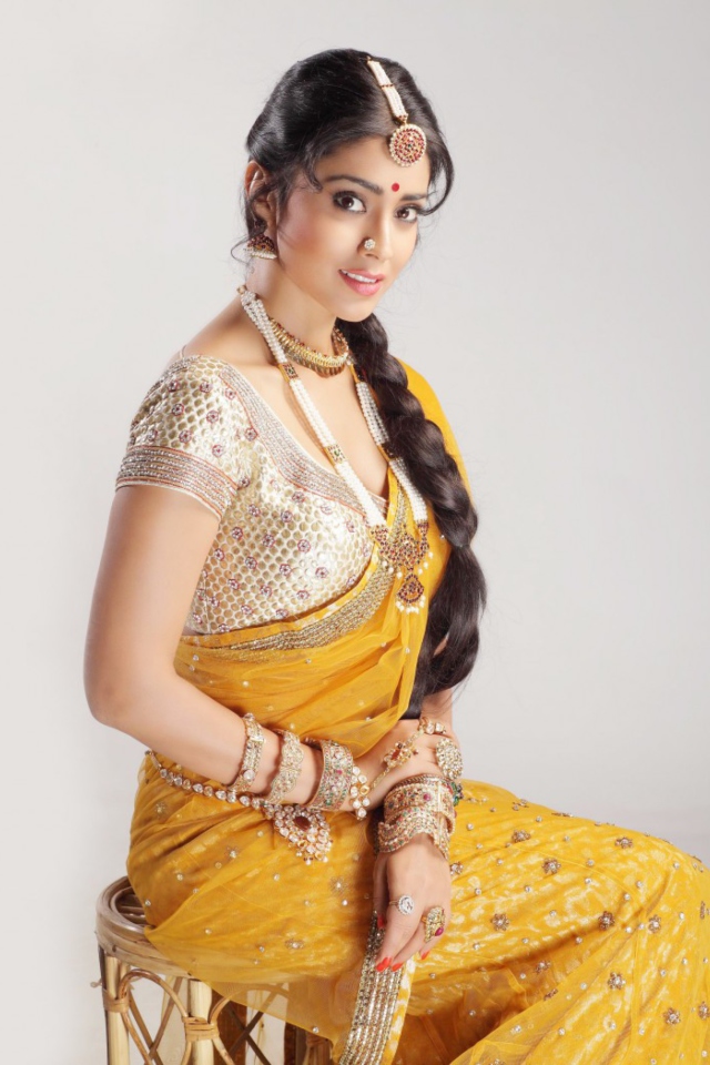 Shriya Saran In Yellow Saree wallpaper 640x960