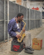 Обои Jazz saxophonist Street Musician 176x220