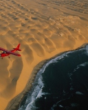 Fondo de pantalla Airplane Above Desert 128x160