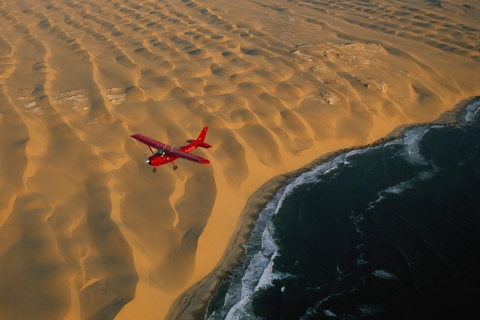 Fondo de pantalla Airplane Above Desert 480x320