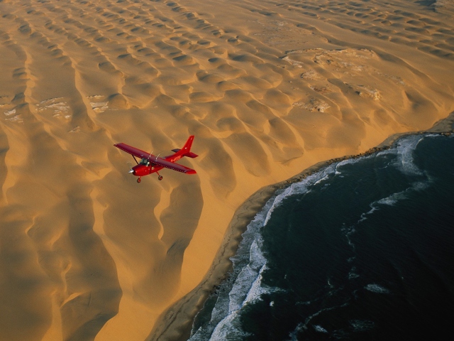 Обои Airplane Above Desert 640x480