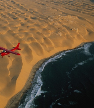 Airplane Above Desert sfondi gratuiti per iPhone XR