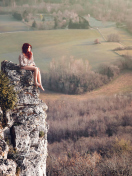 Redhead Girl Sitting On Rock screenshot #1 132x176