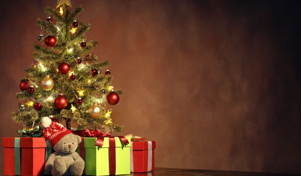 Christmas Presents Under Christmas Tree wallpaper 1024x600