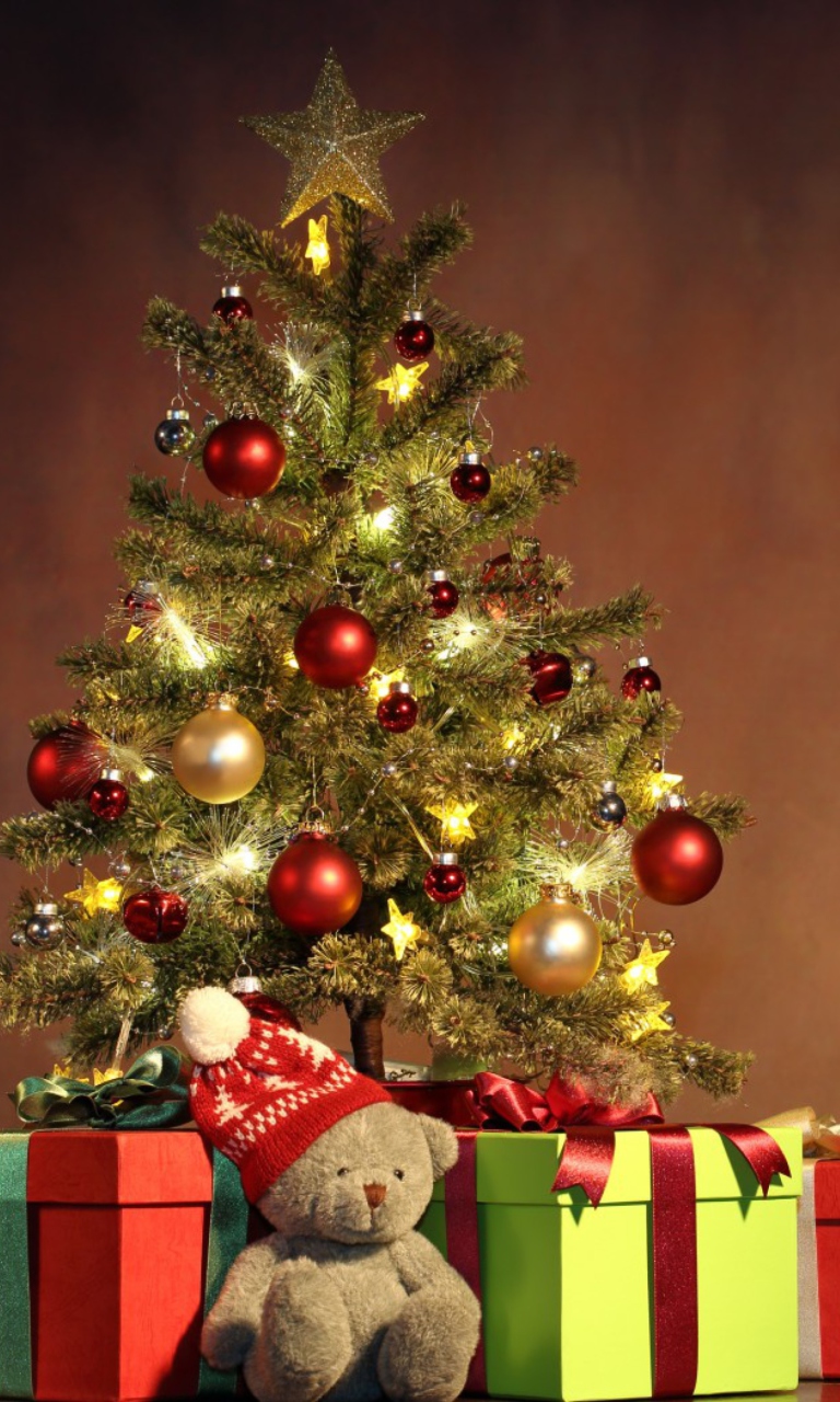 Das Christmas Presents Under Christmas Tree Wallpaper 768x1280