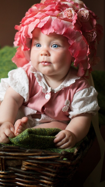 Cute Baby With Blue Eyes And Roses wallpaper 360x640