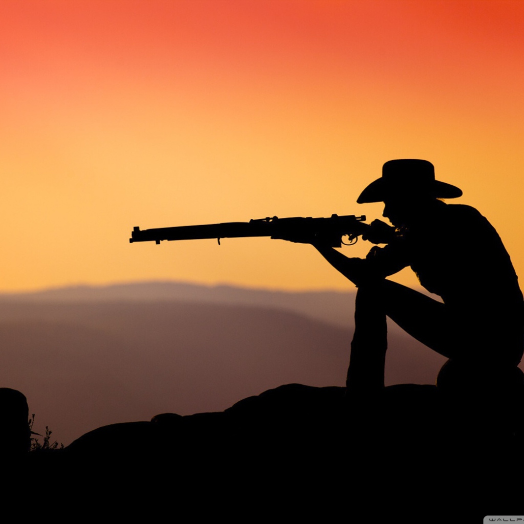 Cowboy Shooting In The Sunset wallpaper 1024x1024