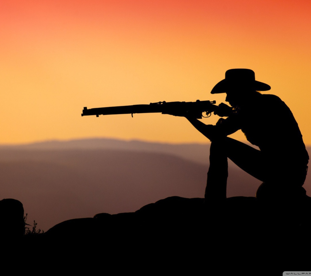 Das Cowboy Shooting In The Sunset Wallpaper 1080x960