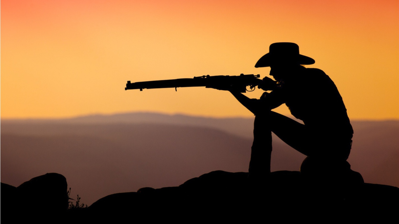 Обои Cowboy Shooting In The Sunset 1366x768