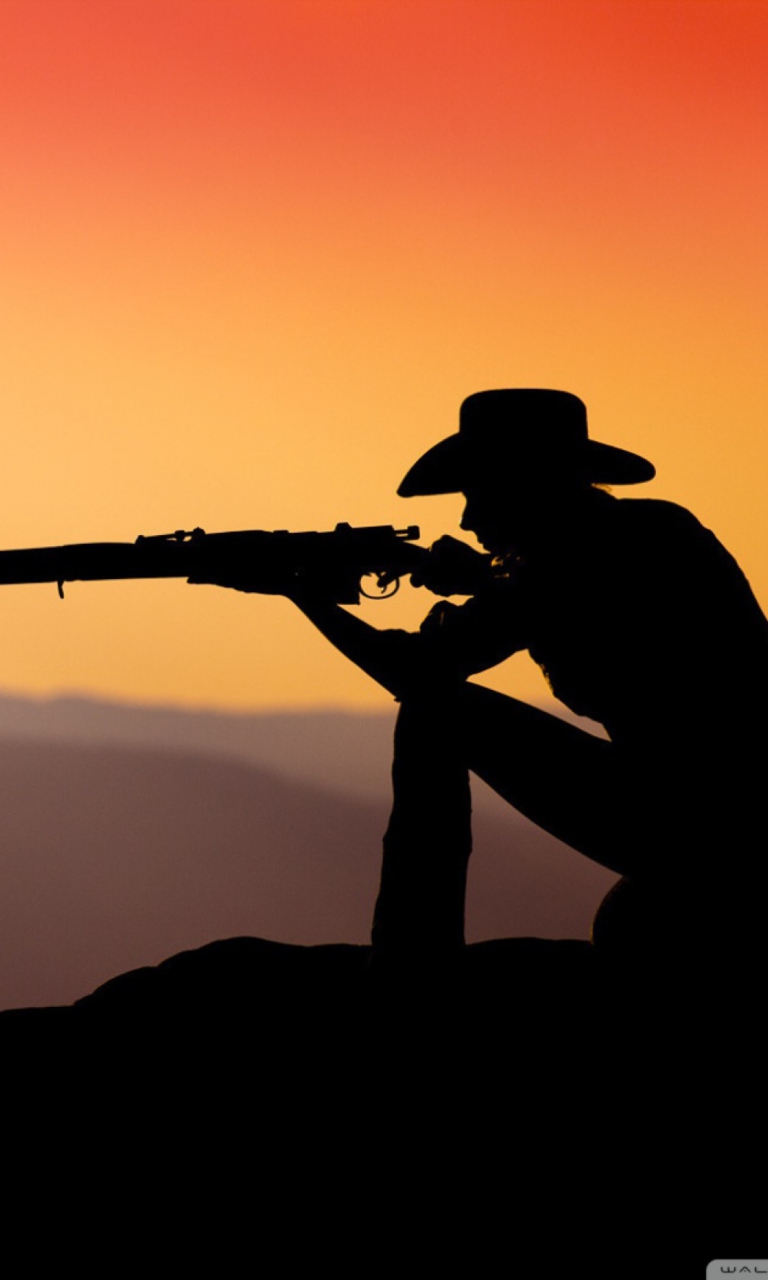 Das Cowboy Shooting In The Sunset Wallpaper 768x1280