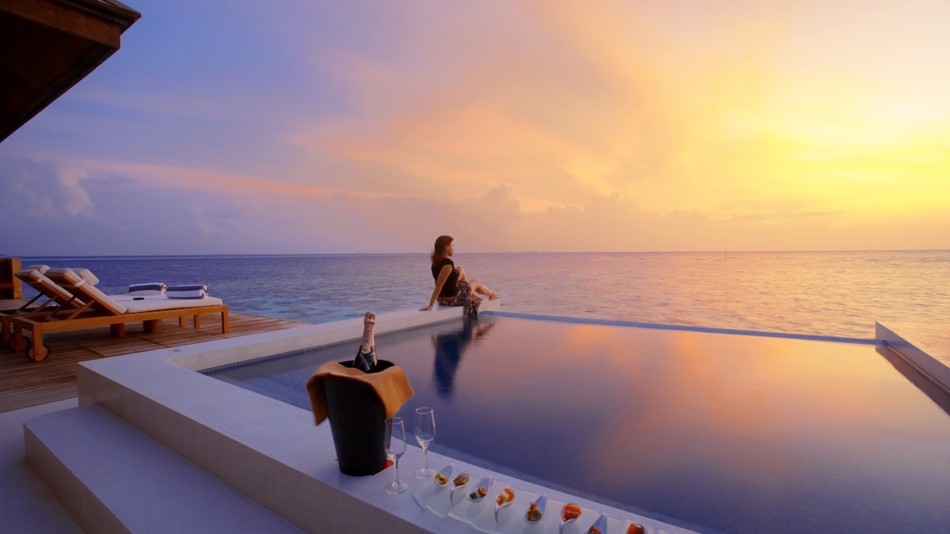 Das Maldives pool with girl Wallpaper 1366x768