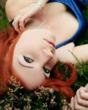 Sfondi Redhead Girl Laying In Grass 128x160