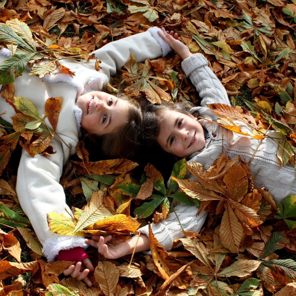 Cute Child Girls On Autumn Leaves Carpet wallpaper 1024x1024