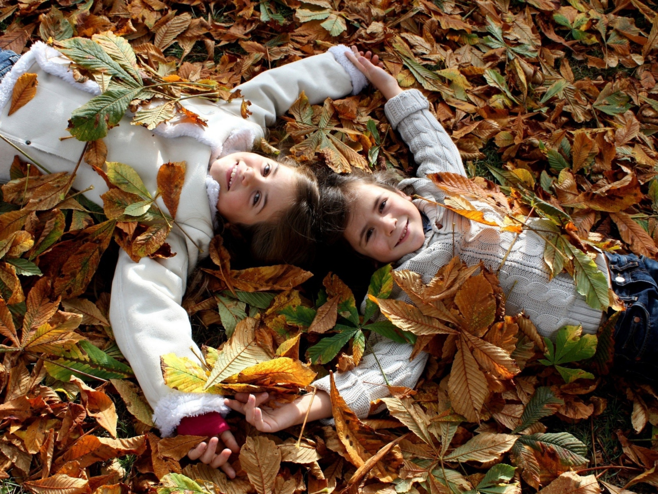 Cute Child Girls On Autumn Leaves Carpet wallpaper 1280x960
